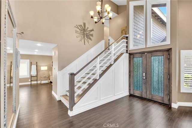 22602 Manalastas Dr, Lake Forest, CA 92630 - foyer entrance with a towering ceiling, dark wood-style flooring, stairs, baseboards, and a chandelier