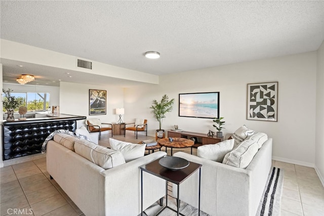 5932 Ellenview Ave, Woodland Hills, CA 91367 - living area featuring light tile patterned floors and a textured ceiling