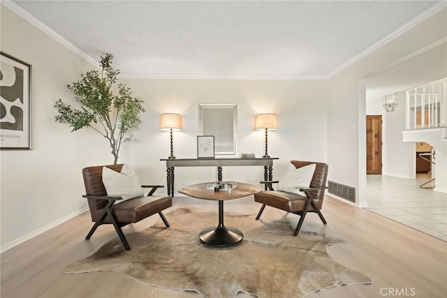 5932 Ellenview Ave, Woodland Hills, CA 91367 - living area featuring crown molding, baseboards, wood finished floors, and a chandelier