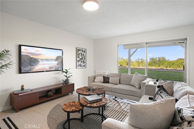 5932 Ellenview Ave, Woodland Hills, CA 91367 - living room with baseboards and a textured ceiling