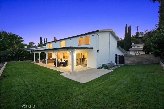5932 Ellenview Ave, Woodland Hills, CA 91367 - rear view of house with an outdoor living space, a patio area, a chimney, and stucco siding