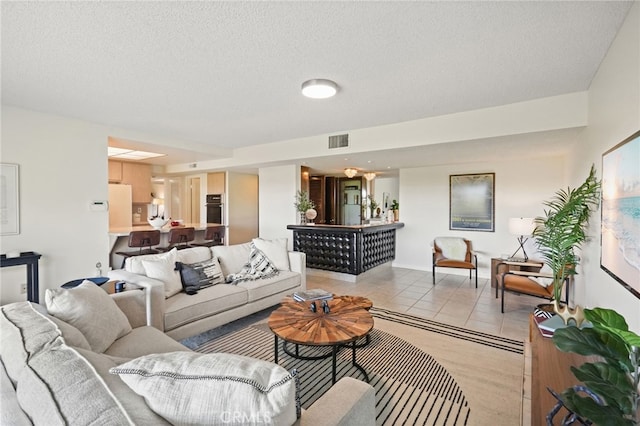 5932 Ellenview Ave, Woodland Hills, CA 91367 - living area featuring a textured ceiling and light tile patterned floors