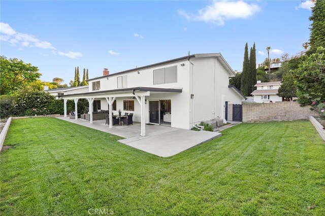 5932 Ellenview Ave, Woodland Hills, CA 91367 - back of property featuring a patio, an outdoor hangout area, stucco siding, and a chimney