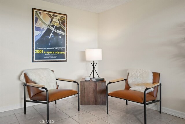 5932 Ellenview Ave, Woodland Hills, CA 91367 - living area with baseboards, tile patterned flooring, and a textured ceiling