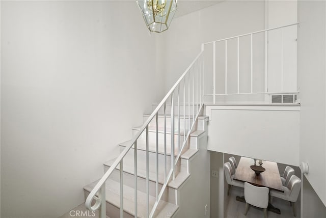 5932 Ellenview Ave, Woodland Hills, CA 91367 - stairs featuring a chandelier