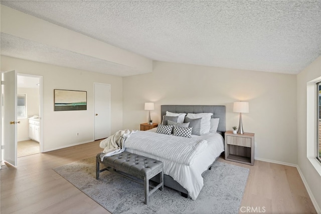 5932 Ellenview Ave, Woodland Hills, CA 91367 - bedroom featuring wood finished floors, a textured ceiling, and baseboards