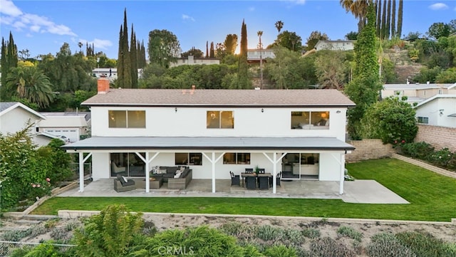 5932 Ellenview Ave, Woodland Hills, CA 91367 - rear view of house featuring a patio area, an outdoor living space, a chimney, and stucco siding