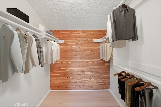 5932 Ellenview Ave, Woodland Hills, CA 91367 - walk in closet with wood finished floors