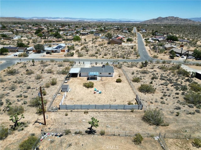 3872 Balsa Ave, Yucca Valley, CA 92284 - aerial perspective of suburban area featuring a mountainous background and a desert landscape
