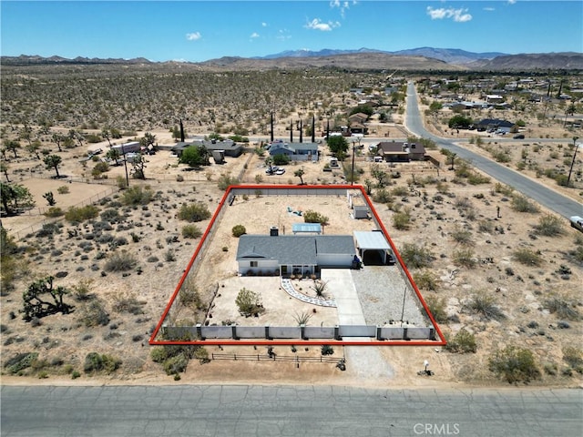 3872 Balsa Ave, Yucca Valley, CA 92284 - overview of rural landscape featuring a desert landscape, property boundaries highlighted, and a mountain backdrop