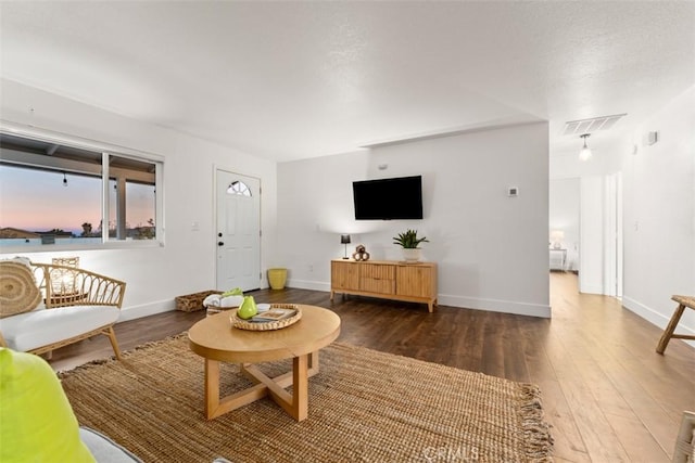 3872 Balsa Ave, Yucca Valley, CA 92284 - living room featuring wood-type flooring and baseboards