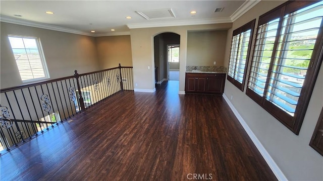 31820 Paseo Tarazona, San Juan Capistrano, CA 92675 - spare room featuring arched walkways, dark wood-style floors, healthy amount of natural light, baseboards, and recessed lighting