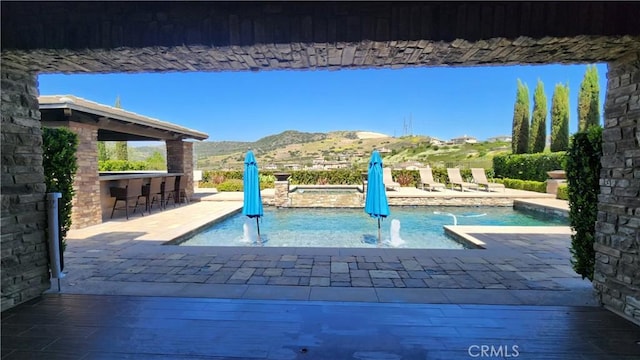 31820 Paseo Tarazona, San Juan Capistrano, CA 92675 - view of pool featuring a mountain view, a patio area, and a pool with connected hot tub