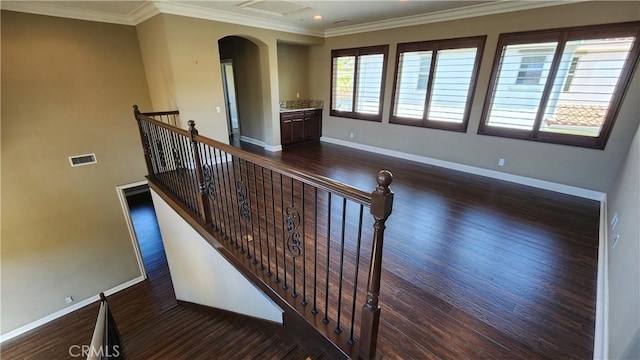 31820 Paseo Tarazona, San Juan Capistrano, CA 92675 - spare room featuring wood finished floors, arched walkways, baseboards, crown molding, and recessed lighting