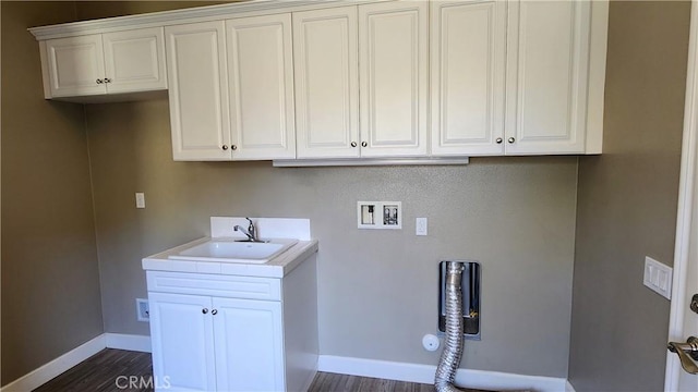 31820 Paseo Tarazona, San Juan Capistrano, CA 92675 - clothes washing area with baseboards, dark wood-type flooring, cabinet space, and gas dryer hookup