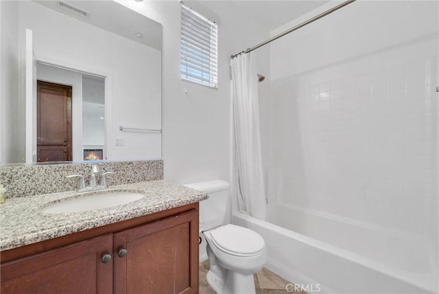 12455 Benton Dr Unit 2, Rancho Cucamonga, CA 91739 - bathroom featuring vanity, shower / bath combination with curtain, and toilet