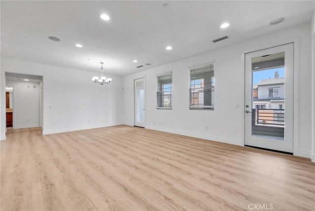 12455 Benton Dr Unit 2, Rancho Cucamonga, CA 91739 - empty room featuring a chandelier, light wood finished floors, recessed lighting, and baseboards