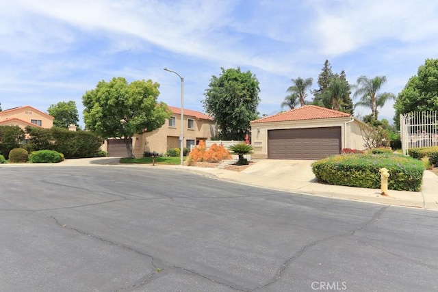 10260 Santa Rosa Ct, Rancho Cucamonga, CA 91730 - view of front of property with stucco siding, concrete driveway, and a tile roof