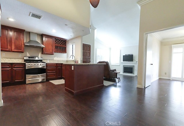 10260 Santa Rosa Ct, Rancho Cucamonga, CA 91730 - kitchen featuring stainless steel gas range oven, wall chimney range hood, dark wood-type flooring, reddish brown cabinets, and crown molding