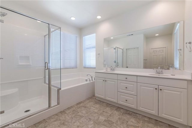 14991 Cavetto Ln, Fontana, CA 92336 - bathroom with a stall shower, a bath, double vanity, and recessed lighting