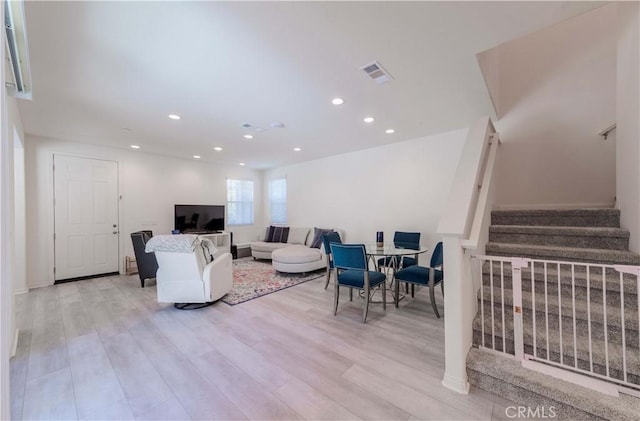 14991 Cavetto Ln, Fontana, CA 92336 - living area featuring stairway, recessed lighting, light wood-style flooring, and baseboards