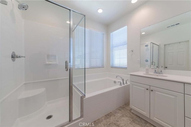 14991 Cavetto Ln, Fontana, CA 92336 - bathroom with a stall shower, a garden tub, vanity, tile patterned flooring, and recessed lighting