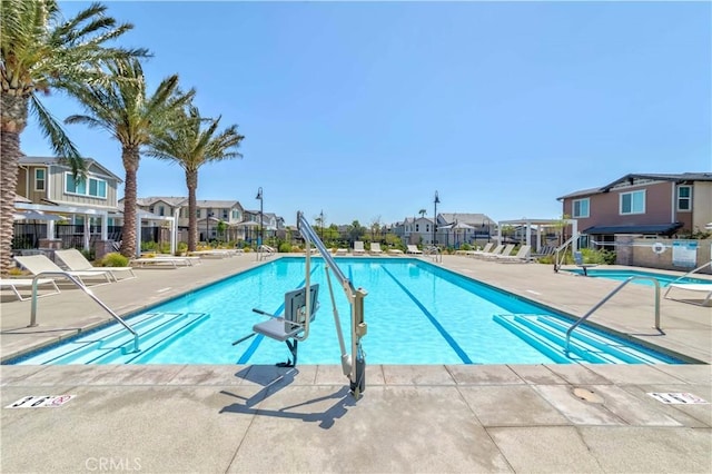 14991 Cavetto Ln, Fontana, CA 92336 - community pool featuring a residential view and a patio area