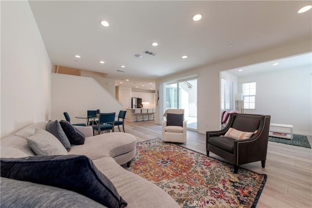 14991 Cavetto Ln, Fontana, CA 92336 - living area featuring plenty of natural light, light wood-type flooring, and recessed lighting