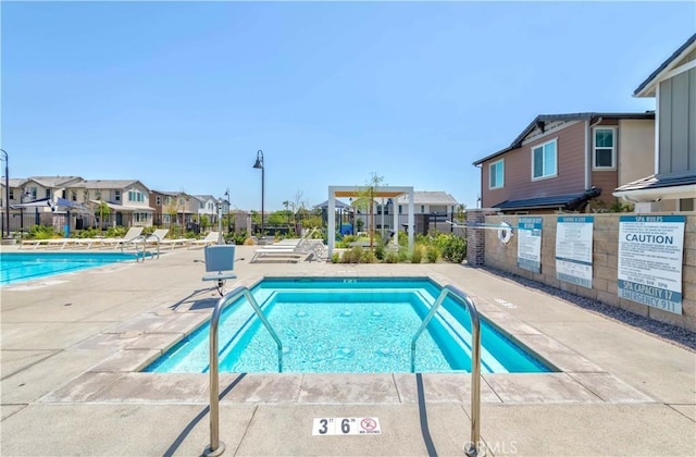 14991 Cavetto Ln, Fontana, CA 92336 - community pool featuring a residential view and a patio area