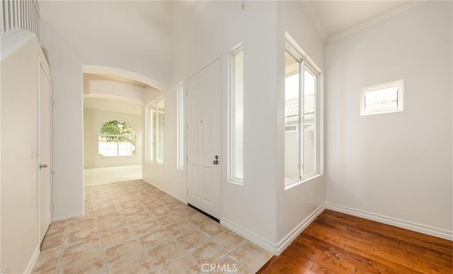 4919 Oakhurst Ave, Banning, CA 92220 - entryway with crown molding, baseboards, and arched walkways