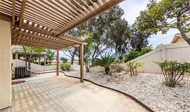4919 Oakhurst Ave, Banning, CA 92220 - view of patio featuring a fenced backyard, a pergola, and central air condition unit