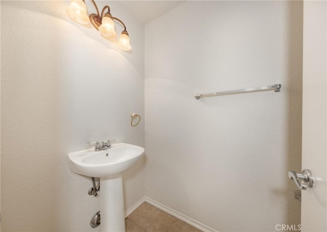 4919 Oakhurst Ave, Banning, CA 92220 - bathroom with tile patterned floors and baseboards