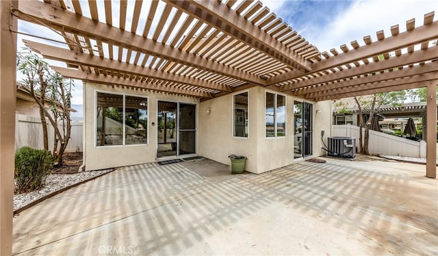 4919 Oakhurst Ave, Banning, CA 92220 - view of patio / terrace featuring fence, central AC unit, and a pergola