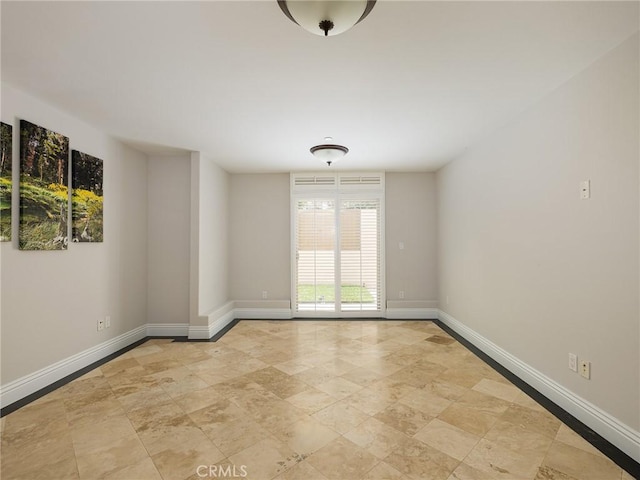 229 N Juanita Ave Unit B, Redondo Beach, CA 90277 - spare room featuring baseboards and stone finish floors