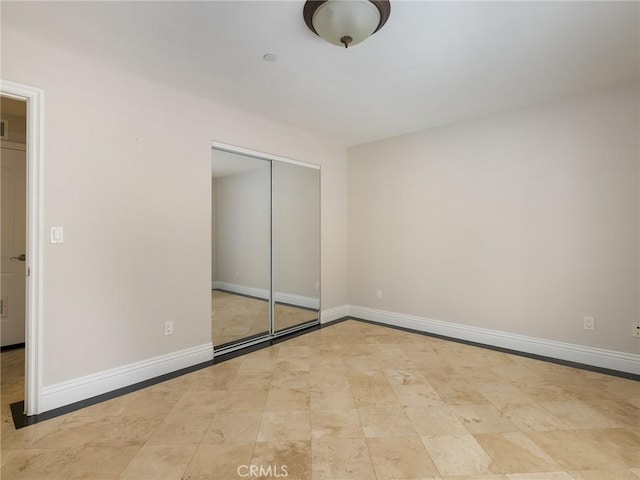229 N Juanita Ave Unit B, Redondo Beach, CA 90277 - unfurnished bedroom with baseboards and a closet