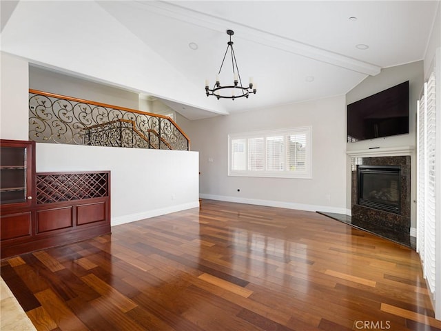 229 N Juanita Ave Unit B, Redondo Beach, CA 90277 - unfurnished living room with wood finished floors, a chandelier, a high end fireplace, and baseboards