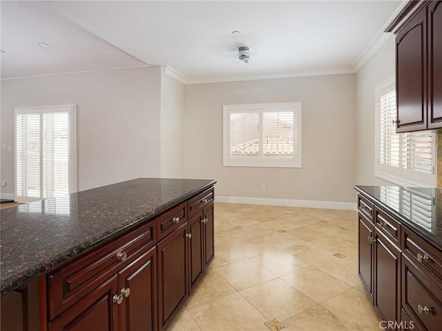 229 N Juanita Ave Unit B, Redondo Beach, CA 90277 - kitchen featuring plenty of natural light, crown molding, dark stone countertops, and baseboards