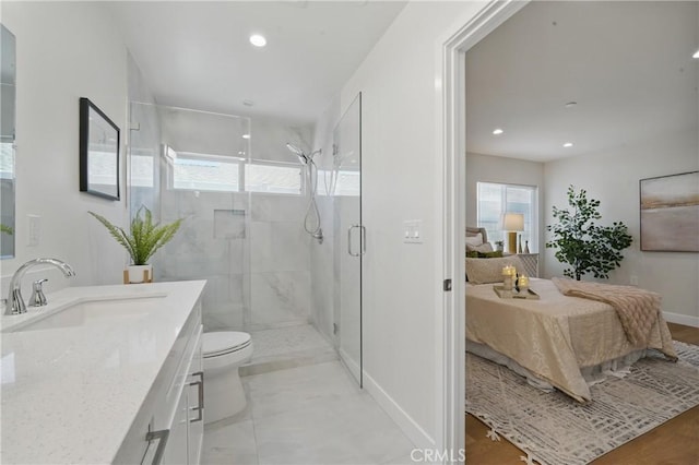 8142 Vantage Ave, North Hollywood, CA 91605 - full bathroom featuring ensuite bath, a stall shower, toilet, baseboards, and vanity