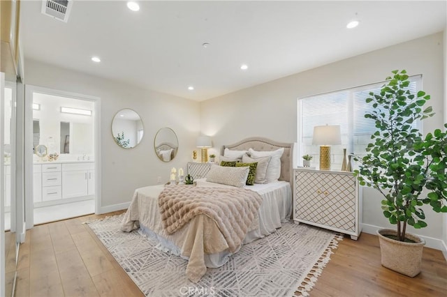 8142 Vantage Ave, North Hollywood, CA 91605 - bedroom featuring light wood-style flooring, connected bathroom, baseboards, and recessed lighting