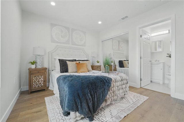8142 Vantage Ave, North Hollywood, CA 91605 - bedroom with light wood-style flooring, recessed lighting, baseboards, ensuite bath, and a sink