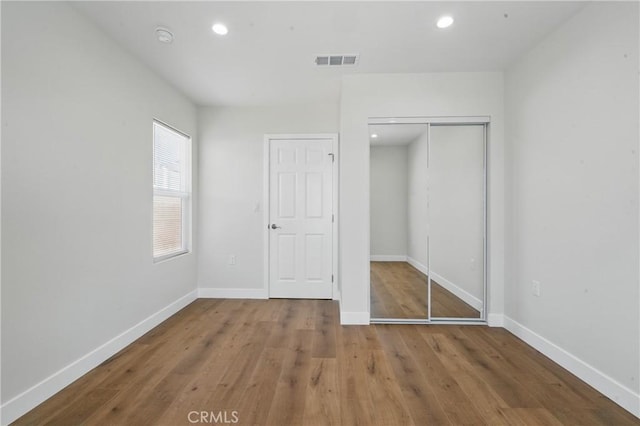 8142 Vantage Ave, North Hollywood, CA 91605 - unfurnished bedroom featuring baseboards, wood finished floors, a closet, and recessed lighting