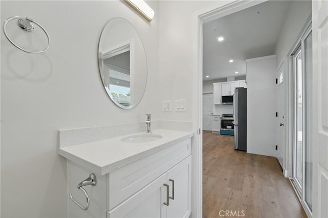 8142 Vantage Ave, North Hollywood, CA 91605 - bathroom with wood finished floors, recessed lighting, and vanity