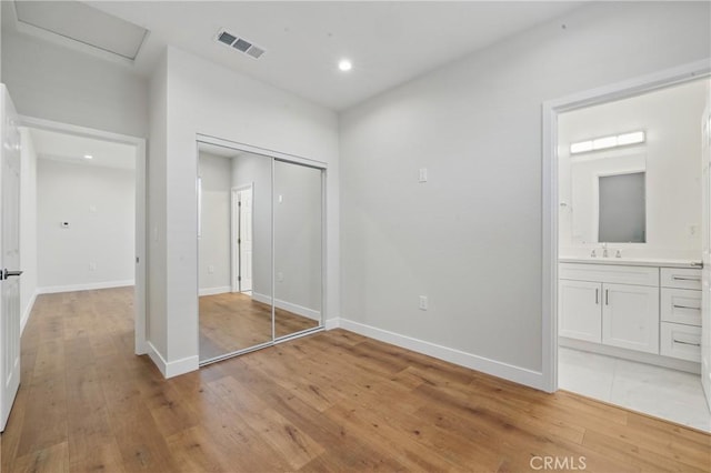 8142 Vantage Ave, North Hollywood, CA 91605 - unfurnished bedroom with light wood-type flooring, a sink, a closet, baseboards, and recessed lighting
