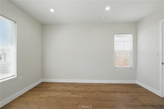 8142 Vantage Ave, North Hollywood, CA 91605 - empty room with light wood-style floors, recessed lighting, and baseboards