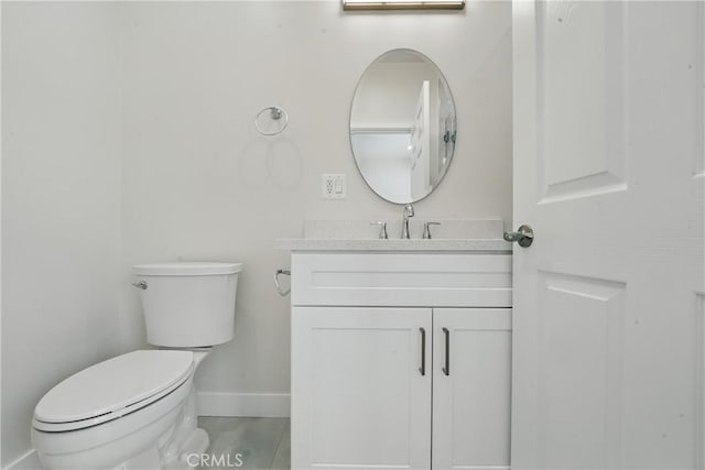8142 Vantage Ave, North Hollywood, CA 91605 - half bathroom with baseboards, toilet, vanity, and tile patterned floors