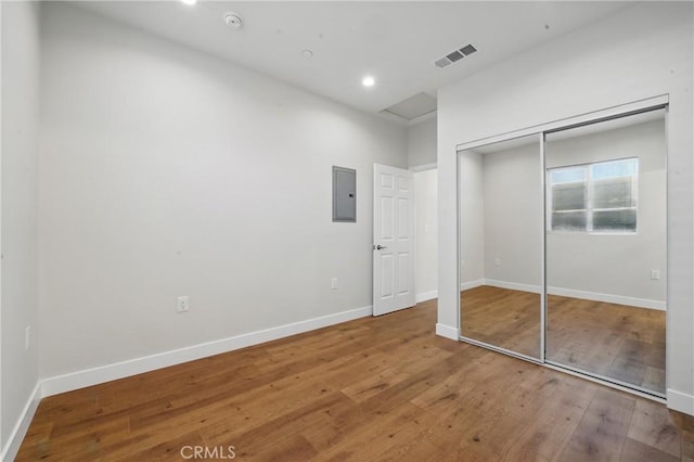 8142 Vantage Ave, North Hollywood, CA 91605 - unfurnished bedroom with wood finished floors, baseboards, electric panel, a closet, and recessed lighting