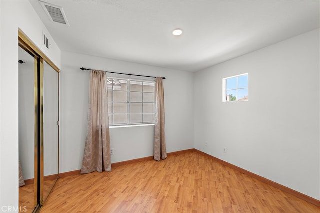 15283 Rousseau Ln, La Mirada, CA 90638 - unfurnished bedroom with light wood finished floors, baseboards, a closet, and recessed lighting