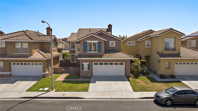 15283 Rousseau Ln, La Mirada, CA 90638 - view of front facade featuring an attached garage, concrete driveway, and stucco siding