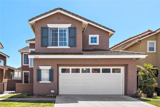 15283 Rousseau Ln, La Mirada, CA 90638 - traditional home with concrete driveway, an attached garage, stucco siding, and fence