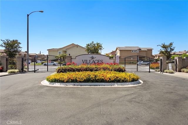 15283 Rousseau Ln, La Mirada, CA 90638 - community / neighborhood sign with a gate, a residential view, and uncovered parking